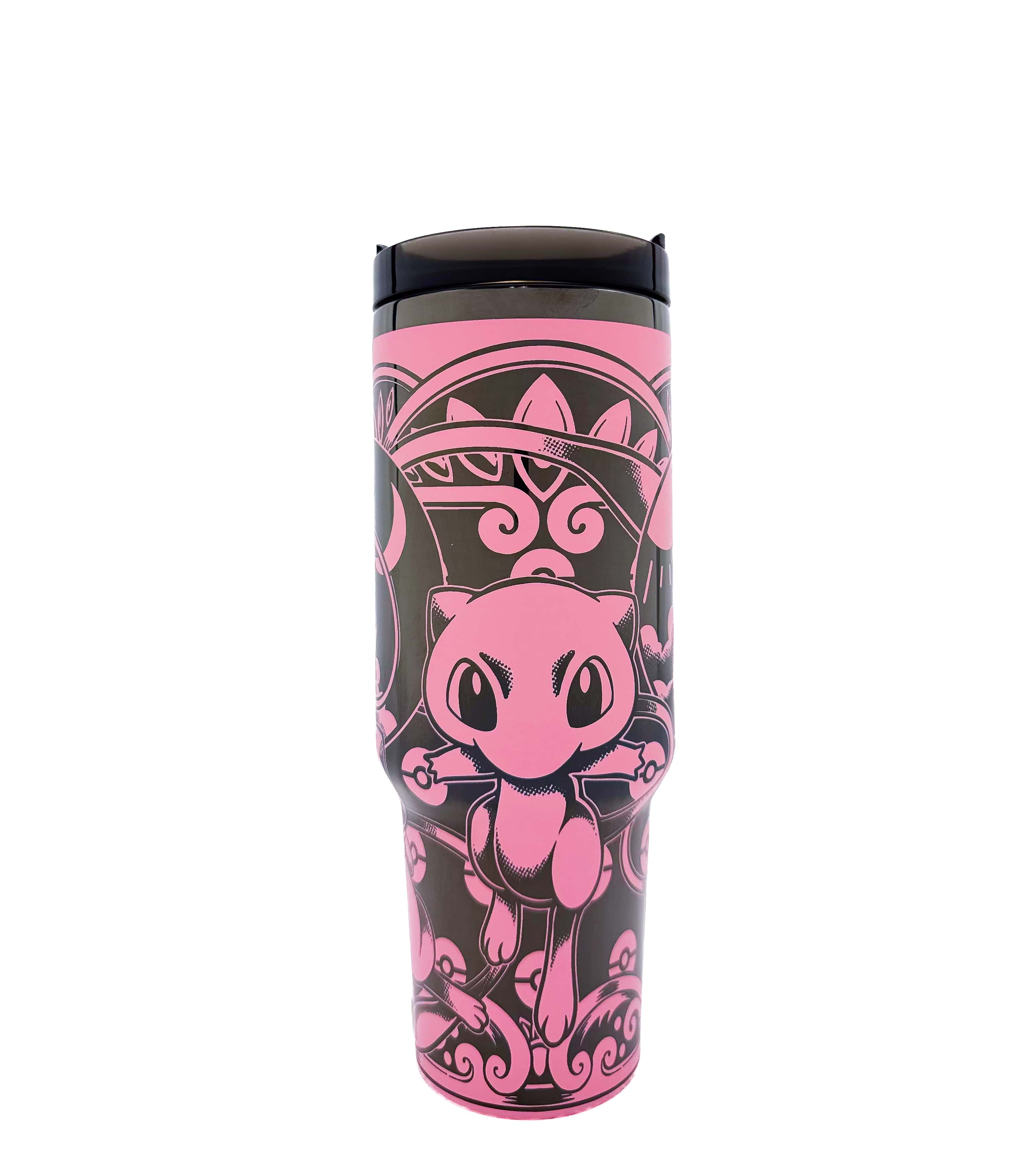 Tumbler with pink and black design featuring a cartoon character on a white background