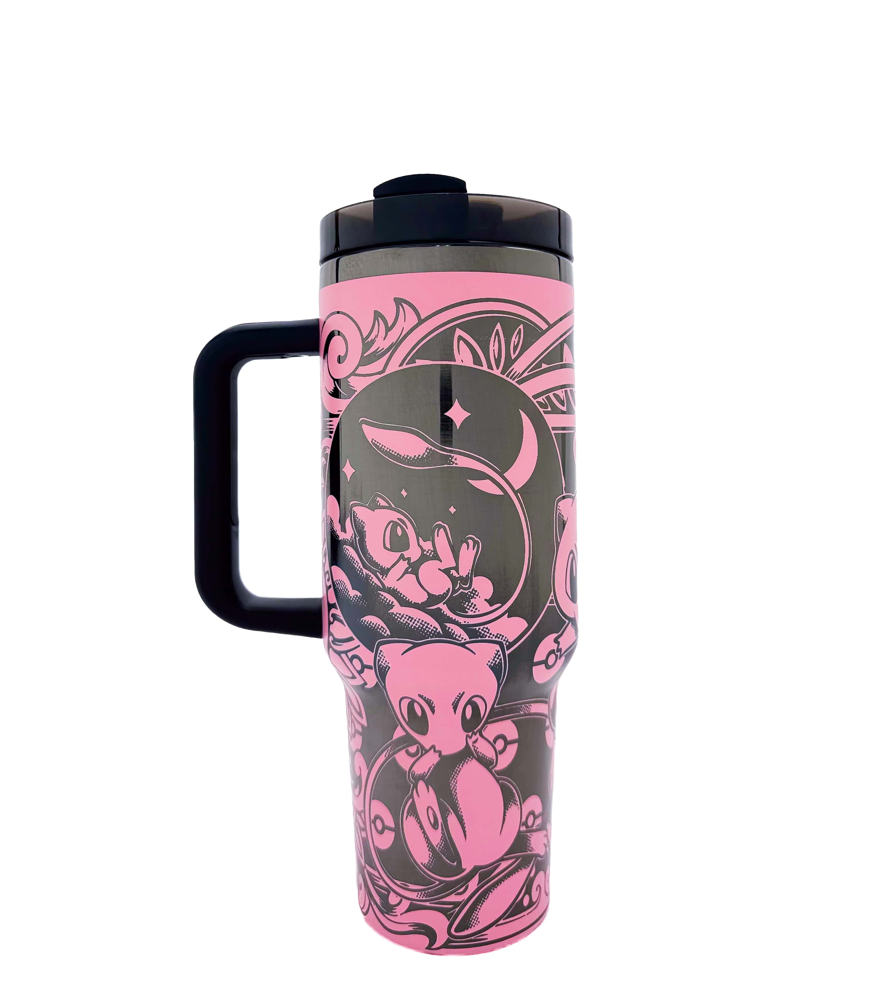Travel mug with pink and black design on a white background